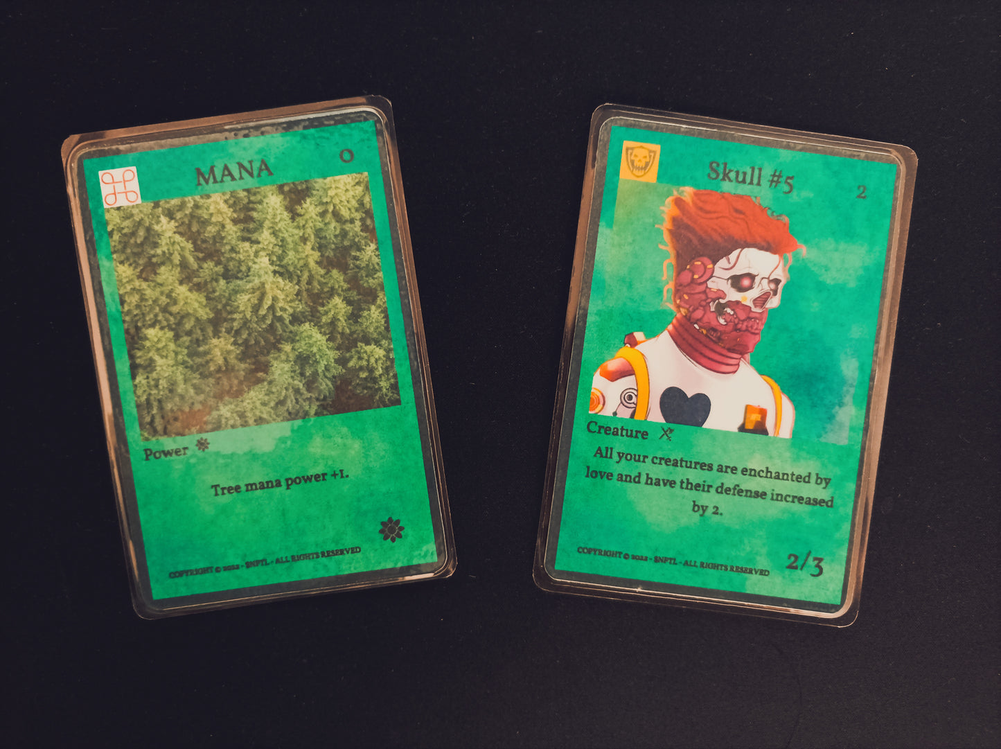 $NFTL Game cards : 1 rare SKULL #5 and 1 common TREE MANA#1